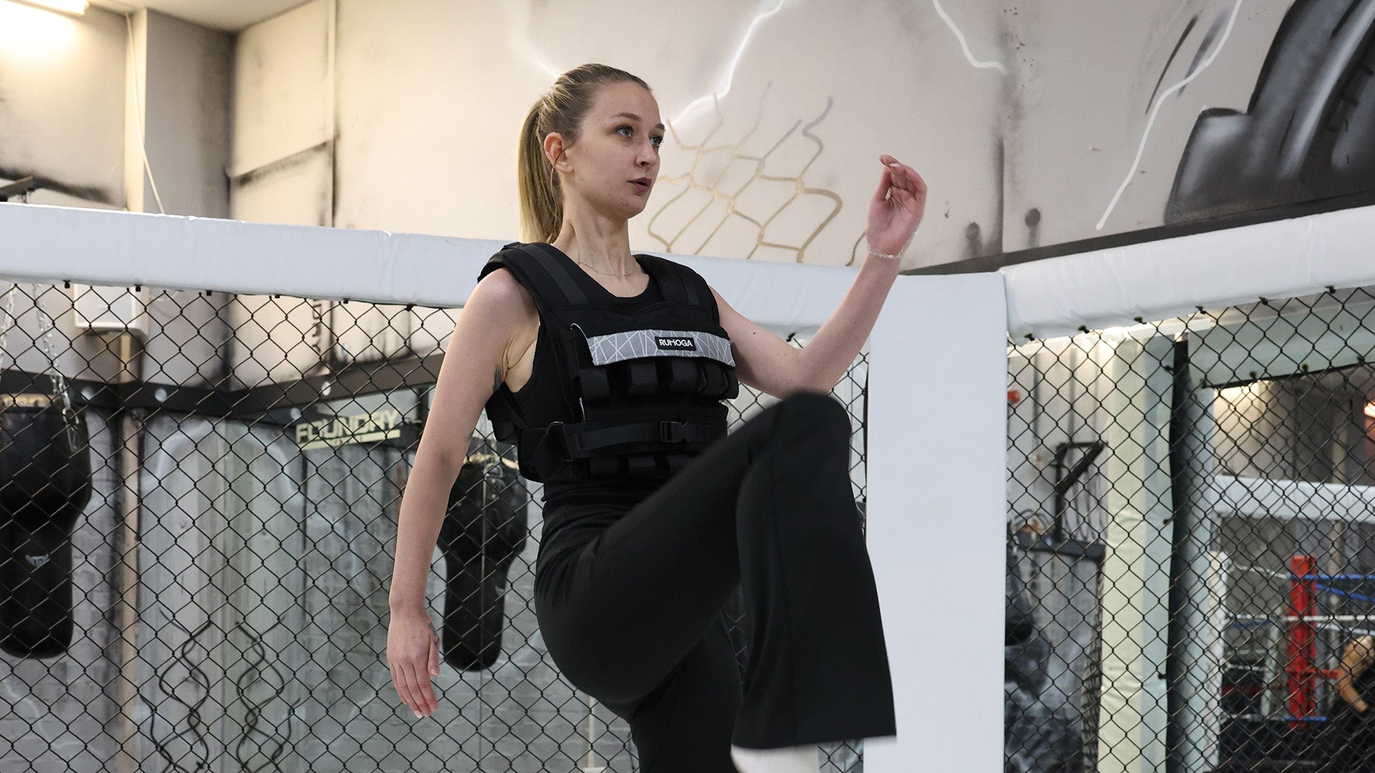 A woman training with 20kg weighted vest